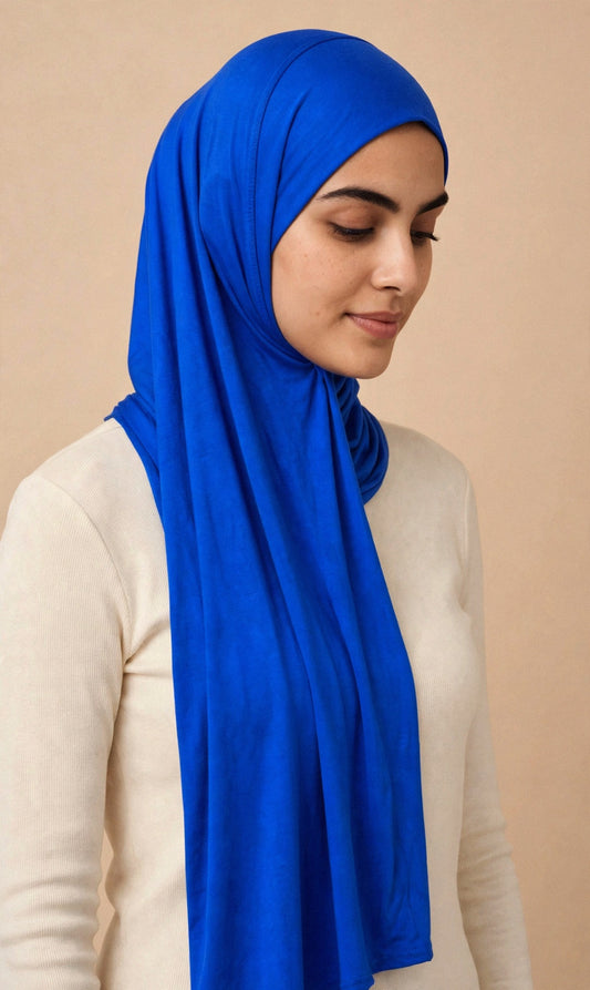 Model wearing the Royal Blue premium jersey hijab styled with a cream top - Concealed Muslimah