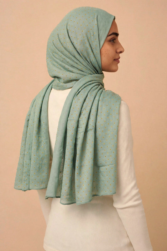 Sage - Opera Hijab worn by a model — shoulder drape view