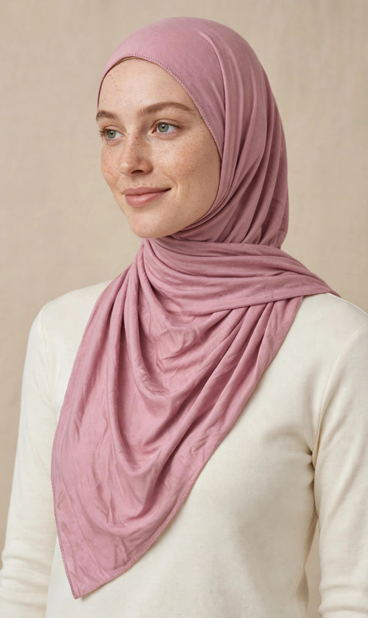 Model wearing the Salmon premium jersey hijab styled with a cream top - Concealed Muslimah