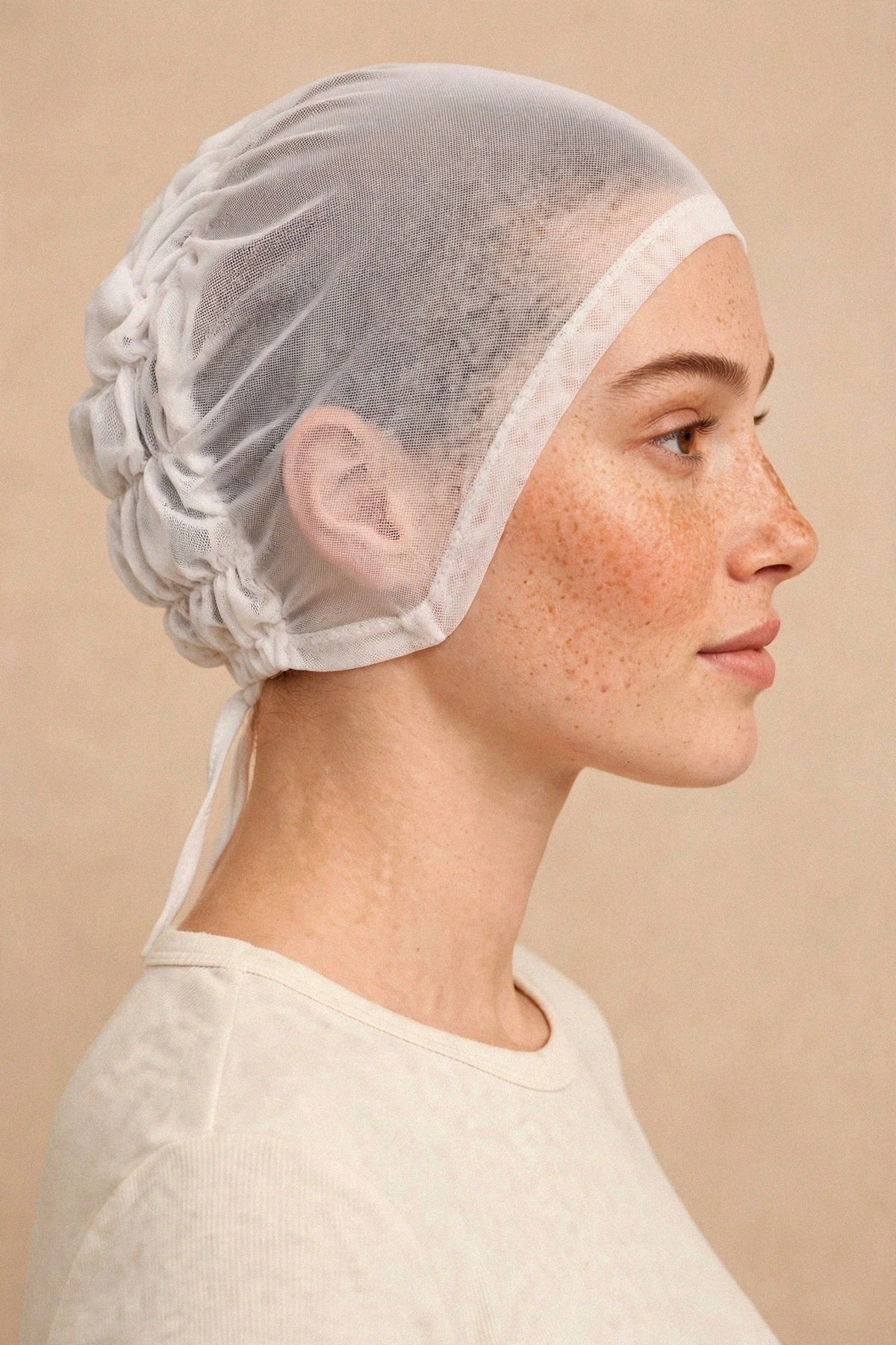 Model wearing the White - Zero Feel Underscarf — side view