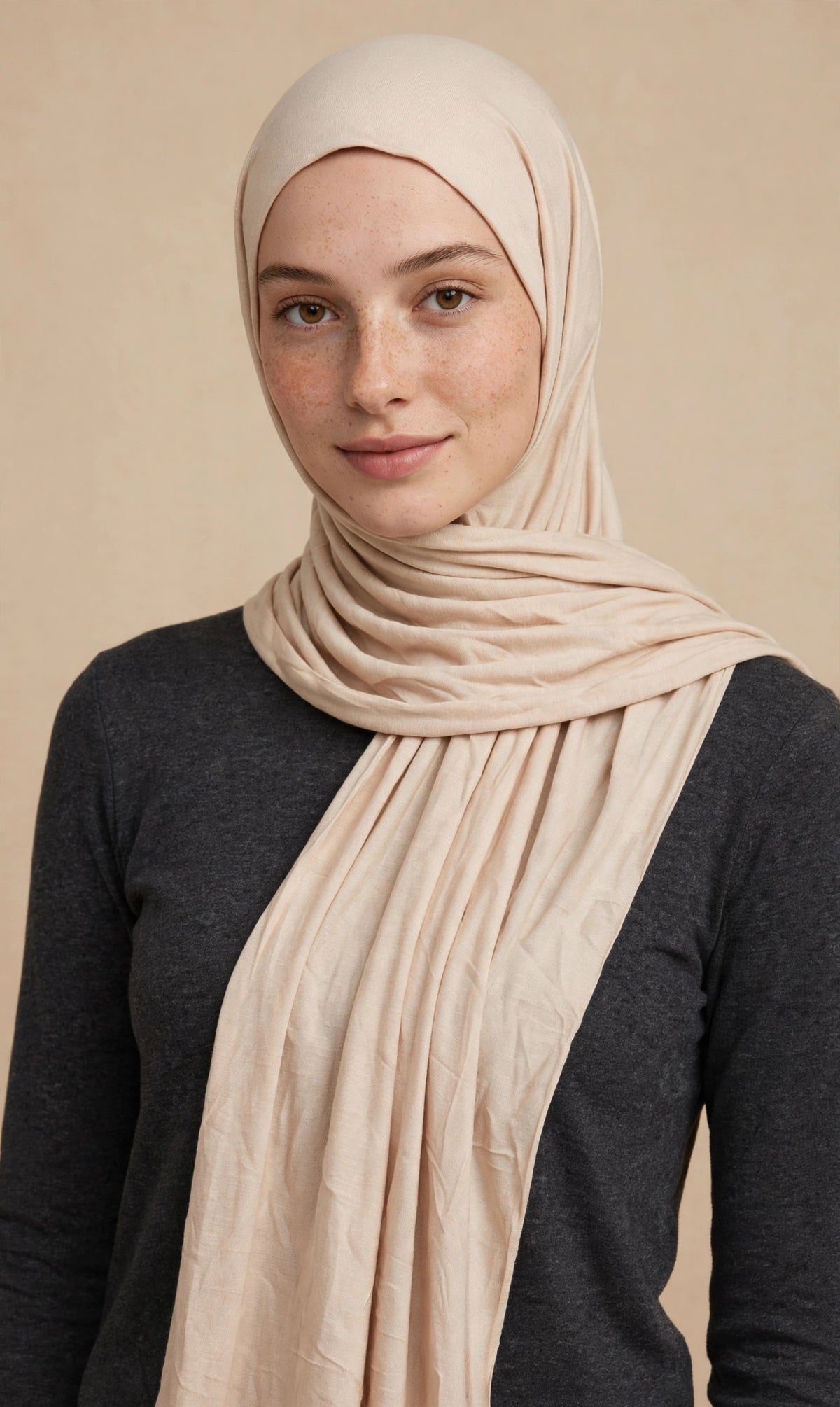 Model wearing the Sand Dunes premium jersey hijab styled with a charcoal top - Concealed Muslimah