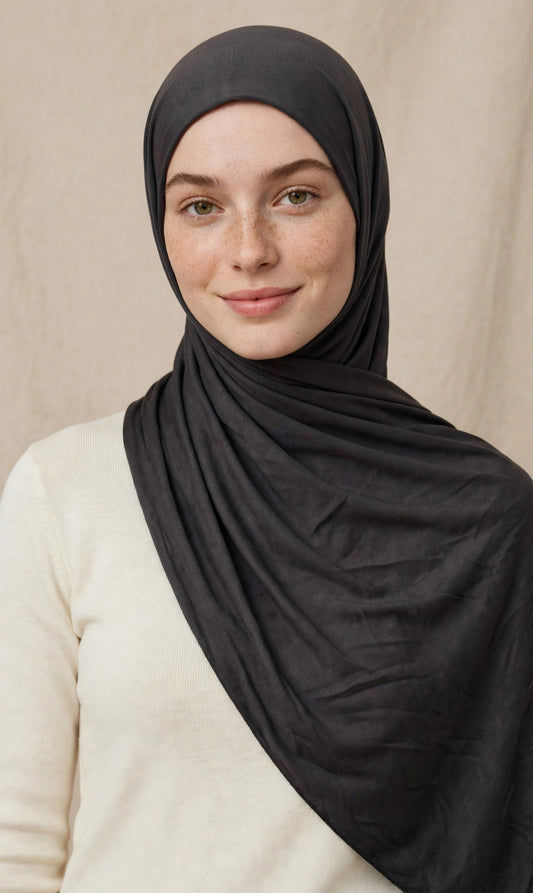 Model wearing the Smoke premium jersey hijab styled with a cream top - Concealed Muslimah