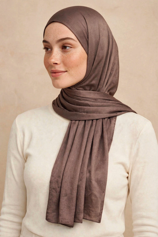 Model wearing the Taupe chrome hijab styled with a cream top - Concealed Muslimah