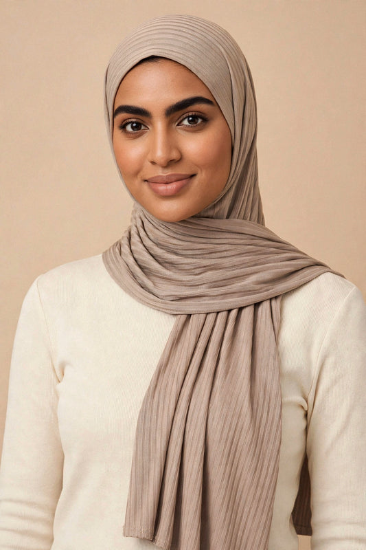 Model wearing the Taupe ribbed jersey hijab styled with a cream top - Concealed Muslimah