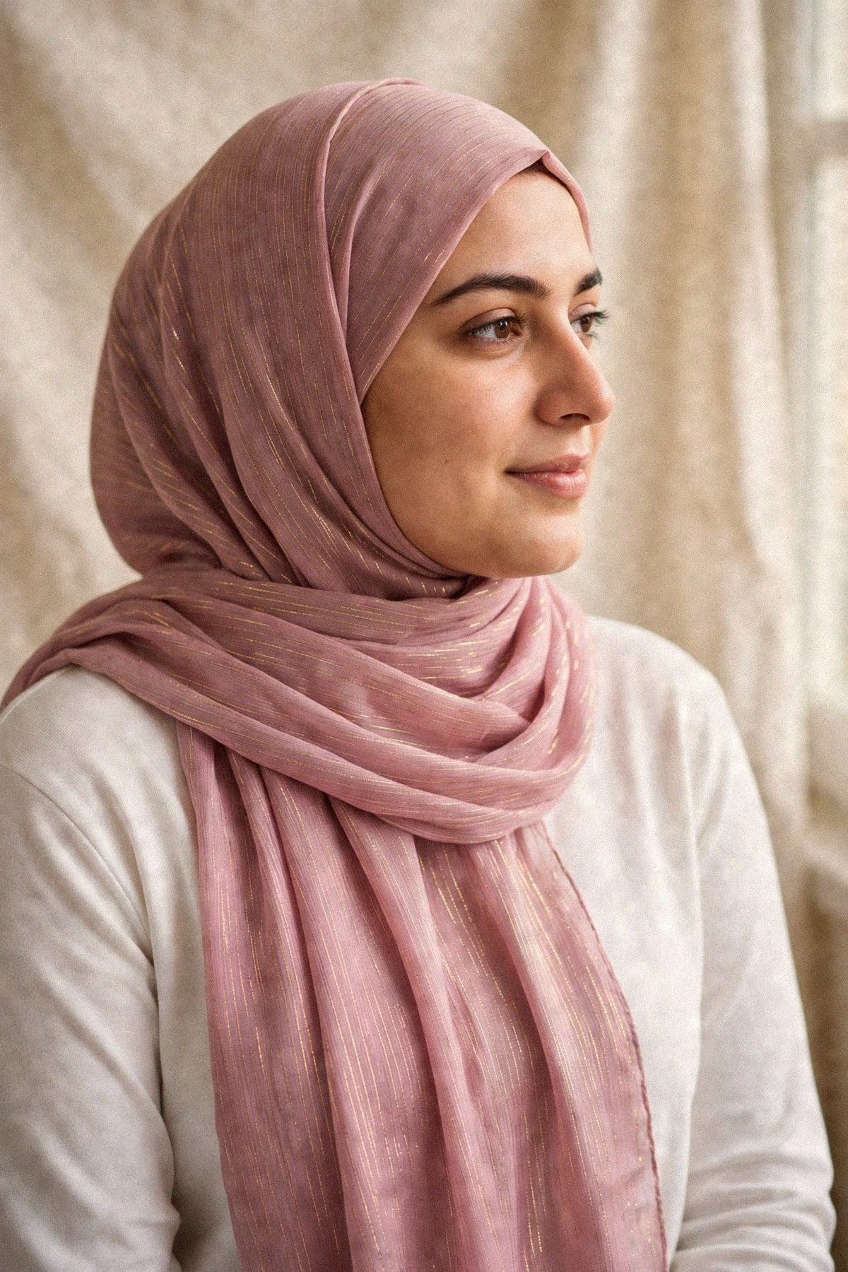 Model wearing the Tea Pink timeless edition hijab styled with a white top - Concealed Muslimah