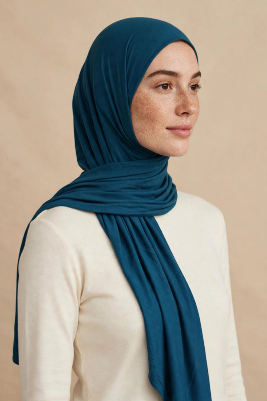 Model wearing the Teal premium jersey hijab styled with a cream top - Concealed Muslimah