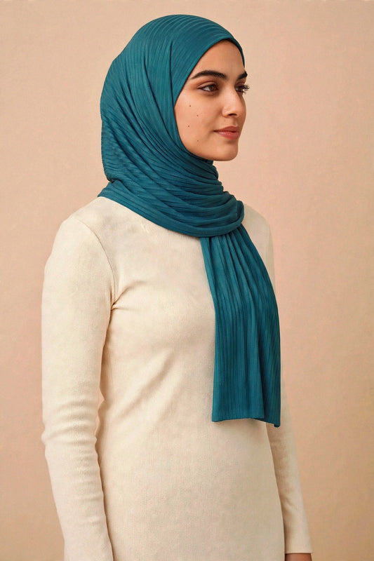 Model wearing the Teal ribbed jersey hijab styled with a cream top - Concealed Muslimah